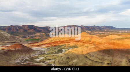 Evening light hits the painted hills in Oregon's John Day Fossil Beds National Monument Stock Photo