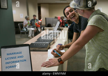 Catherine Simonsen (hat) and Laura Rivera celebrate while applying for a marriage license in Georgia on June 26, 2016. Stock Photo