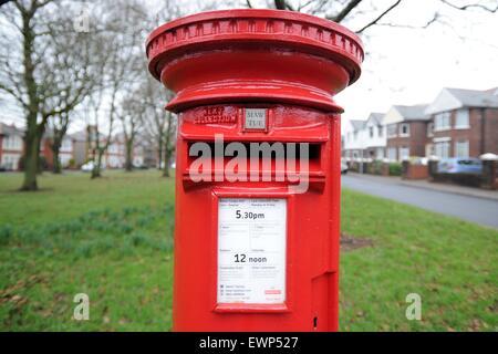 A red Royal Mail post box. Stock Photo