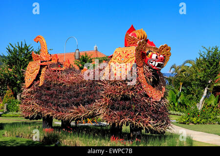 A Barong Mask with a body made of plants, in a Balinese garden. Bali, Indonesia Stock Photo