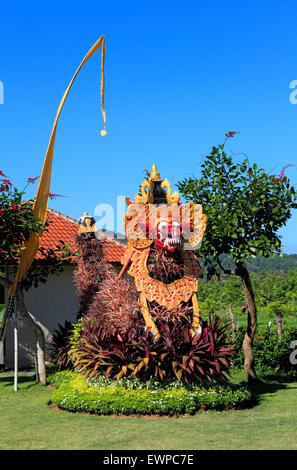 A Barong Mask with a body made of plants, in a Balinese garden. Bali, Indonesia Stock Photo