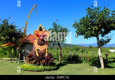 A Barong Mask with a body made of plants, in a Balinese garden. Bali, Indonesia Stock Photo