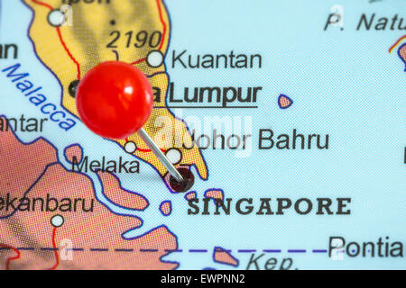 Close-up of a red pushpin on a map of Singapore Stock Photo