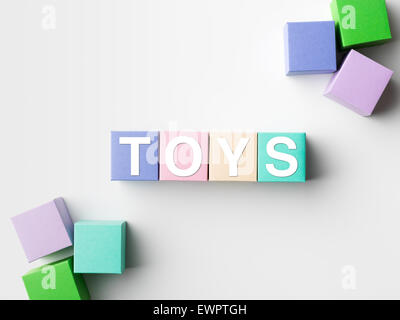 multicolored blocks with toys word written on them, on white background. copy space available Stock Photo