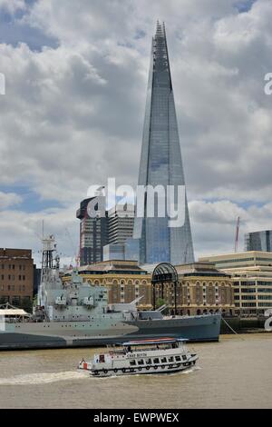 Sightseeing boat on the Thames in front of The Shard, 310 meters, Europe's tallest building in 2012, London, England Stock Photo