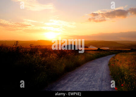 Brighton, 19 June 2015: The sun sets over the South Downs National Park with The American Express Community Stadium nestling in Stock Photo