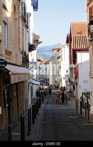 People walking along the Rue Garat street in Saint-Jean-de-Luz (Donibane Lohizune). France. Stock Photo