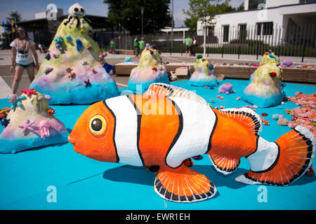 Bonn, Germany. 29th June, 2015. Activists of nature conservation group WWF have set up crocheted aquatic animals and a fake clown fish made of cardboard during a meeting of the UNESCO World Heritage Site Committee in Bonn, Germany, 29 June 2015. The committee is likely to decide on Wednesday whether the Great Barrier Reef, the world's largest coral reef system, will be included in the Red List. PHOTO: MARIUS BECKER/dpa/Alamy Live News Stock Photo