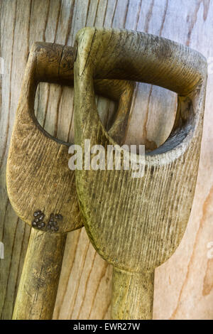 Wooden handles of garden tools. Stock Photo