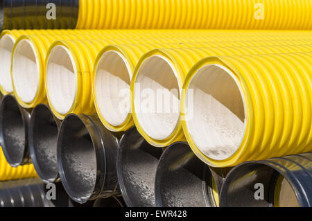 Stack of corrugated plastic pipes Stock Photo