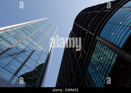 Wide-angle view looking up at a modern glass and steel, high-rise office building, in Threadneedle Walk,  City of London. Stock Photo