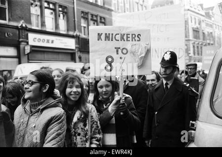 Angry Post Office workers who are on strike, march through the streets of London, on their way to Speakers Corner in Hyde Park. A group of telephonists in the march, carrying a banner saying 'Knickers to 8%'. London, 4th March 1971. Stock Photo