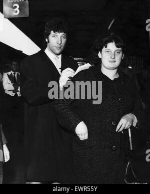 Welsh singing star Tom Jones signs an autograph for a fan at Cardiff Central Railway Station on his arrival. July 1965 Stock Photo