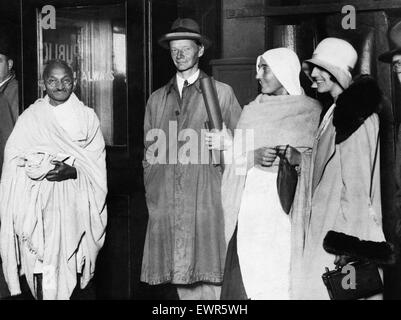 Mohandas 'Mahatma' Gandhi, leader of the  Indian independence movement in British-ruled India, pictured during his visit to Britain in 1931. Here he is pictured at New Street Station in Birmingham prior to departing for London, accompanied by Mr H G Alexa Stock Photo