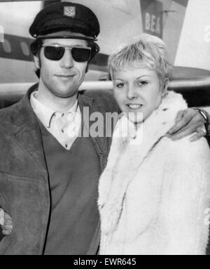 Welsh singing star Tom Jones pictured with his wife Linda after arriving from France. 8th April 1965 Stock Photo