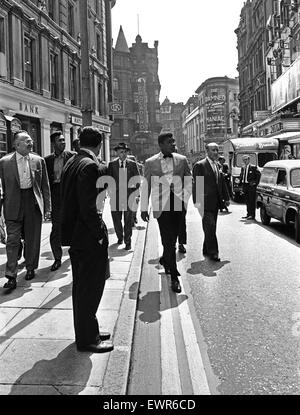 Cassius Clay (Muhammad Ali) (centre) in London England ahead of his next fight. 27th May 1963 Stock Photo