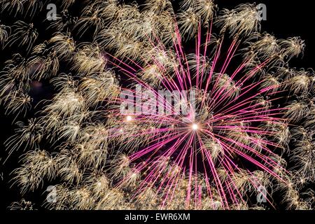 Light drawn picture made due to long time exposure of fireworks explosion against black sky Stock Photo