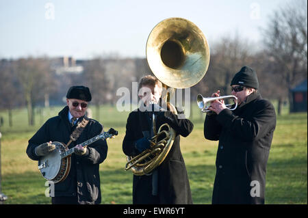 A small brass band plays on an autumnal morning on Clapham Common