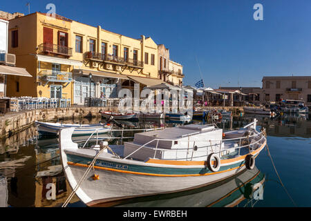 Boat anchored in the Old Venetian harbour, Rethymno Crete harbour Greece Stock Photo