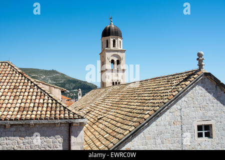 tower of franciscan monastery above rooftops, from old city wall, dubrovnik, croatia Stock Photo