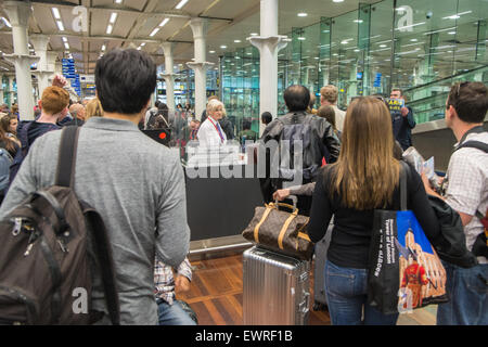 Passport control immigration checkpoint at St Pancras train station prior to boarding Eurostar train to Paris,France Stock Photo