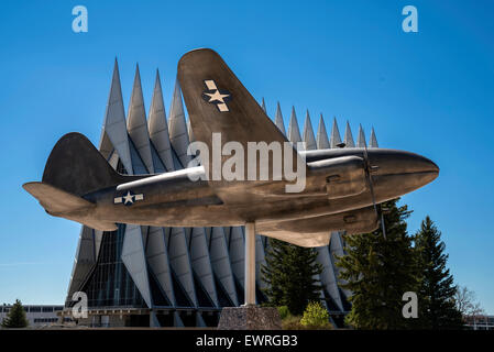 US combat aircraft during WW2 on pedestal   on the background of Cadet Chapel , Air Force Academy, Colorado Springs , USA Stock Photo