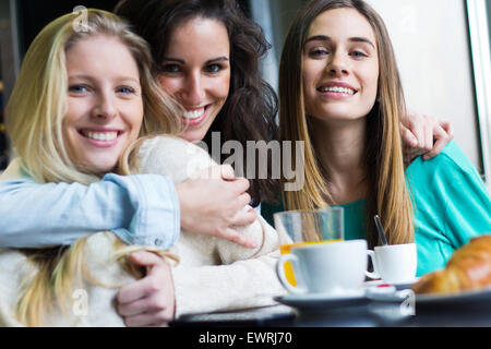 Portrait of Three young women having coffee break Stock Photo