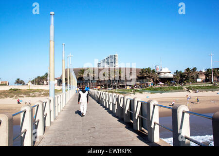 Many unknown people on pier and beach in front of Ushaka Marine World in Durban, South Africa Stock Photo