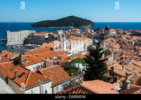 old city with clock tower,cathedral-treasury tower,st. john's fort and lokrum island in background,dubrovnik, croatia Stock Photo