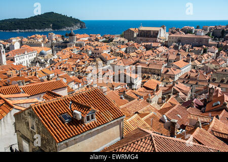terracota rooftop scene of old city with lokrum island in background,dubrovnik, croatia Stock Photo