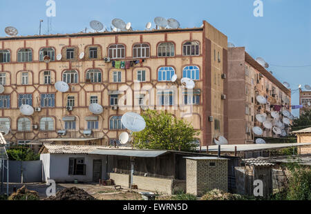 Satellite dishes sprout like mushrooms from Soviet-era apartment blocks in Mary, Turkmenistan Stock Photo