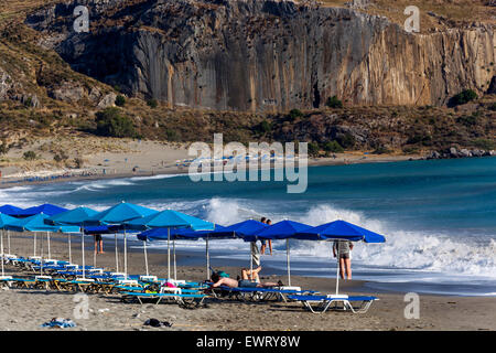 Blue umbrellas on the Beach of Plakias, South Crete beach Greece Europe Stock Photo