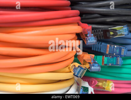 Internet Router Colorful Router and switch with colorful LAN cables in a network cabinet of a ...