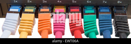 Colorful network cables connected to a switch Stock Photo