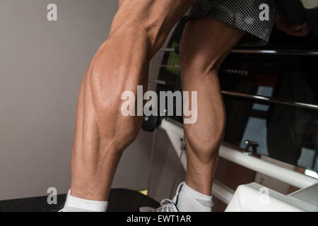 Bodybuilder Doing Heavy Weight Exercise For Legs Stock Photo