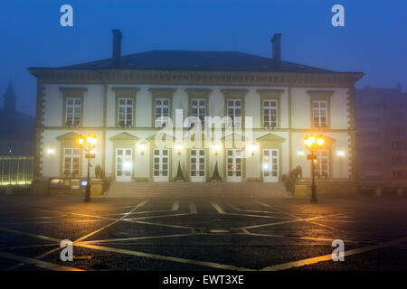 Morning fog by City Hall. Notre Dame Cathedral on the left. Luxembourg City, Luxembourg. Stock Photo
