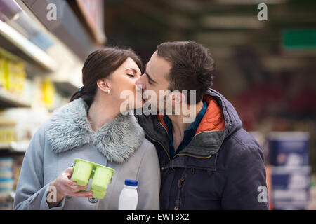 Beautiful Young Couple Shopping For Fruits And Vegetables In Produce Department Of A Grocery Store - Supermarket - Shallow Deep  Stock Photo