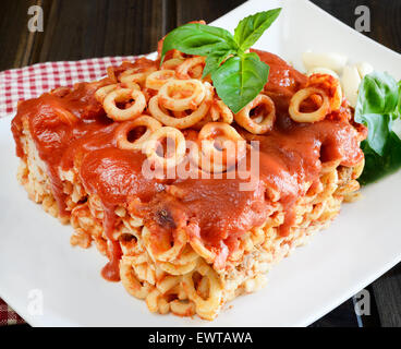 small rings of  Sicilian pasta with olive and capers tomatoes Stock Photo