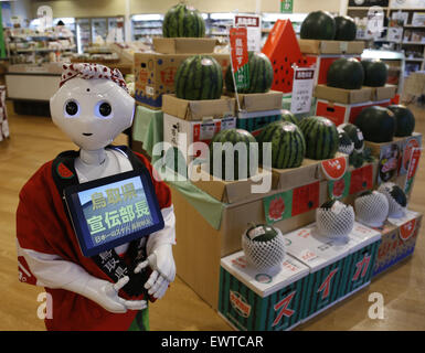 Tokyo, Japan. 1st July, 2015. A Softbank's humanoid robot 'Pepper' works as a part time staff at a speciality shop selling Tottori prefecture's products in Tokyo, Japan, July 1, 2015. 'Pepper' will work at the shop until July 2 with 1,500 JPY (about 12 U.S. dollars) per hour. Credit:  Stringer/Xinhua/Alamy Live News Stock Photo