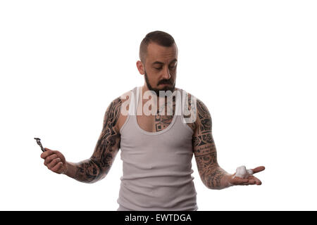 Tattooed Man Styling Beard Holding Disposable Razor - Isolated On White Background Stock Photo