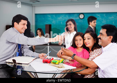 indian Parents and Salesperson new car Dealing Stock Photo