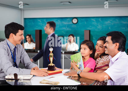 indian Parents and Salesperson education loan Stock Photo