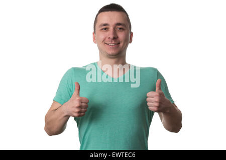 Young Man Shows His Fingers Up To The Camera - Isolated On White Background Stock Photo