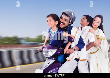 South Indian Parents and kids Riding Scooty Stock Photo