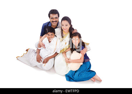 South Indian Parents and kids sitting enjoy Stock Photo