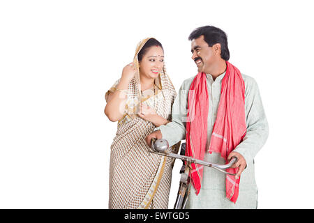 2 indian Rural Married Couple Riding Cycle Stock Photo