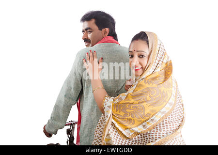 2 indian Rural Married Couple Riding Cycle Stock Photo