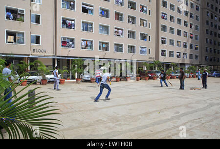 Mumbai, Maharashtra, India. 4th Sep, 2013. 4 Sept. 2013 : Bhendi Bazaar, Mumbai, INDIA:.Children play cricket at The Transit Residential site at Anjirwadi, Mumbai where about 1600 people have been temporarily shifted pending work on the Bhendi Bazaar re-development project.STORY :.In Bhendi Bazaar, a market district, in the heart of Mumbai, dilapidated old buildings line the streets. Many have cramped, dark, dingy interiors with crumbling staircases. Some are precariously supported by bamboo poles. Giant rats scurry across the floors. Such decayed surroundings ought to be deserted, but Stock Photo