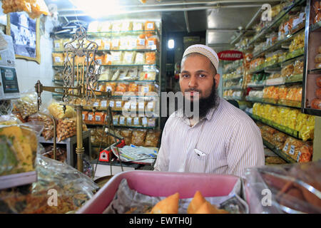 Mumbai, Maharashtra, India. 4th Sep, 2013. 4 Sept. 2013 : Bhendi Bazaar, Mumbai, INDIA:.Fakhruddin Mithaiwala who owns a small snack shop at Bhendi Bazaar is happy about the re-development project under taken by the Saifee Burhani Upliftment Trust.STORY :.In Bhendi Bazaar, a market district, in the heart of Mumbai, dilapidated old buildings line the streets. Many have cramped, dark, dingy interiors with crumbling staircases. Some are precariously supported by bamboo poles. Giant rats scurry across the floors. Such decayed surroundings ought to be deserted, but Bhendi Bazaar district, w Stock Photo