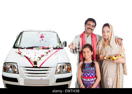 indian Rural Parents and daughter new car Worship Stock Photo